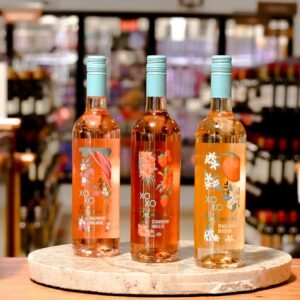 clear glass bottles on brown wooden table