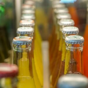 a close up of many bottles of soda